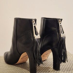 Sleek Black Boots With Tassel Back Zippers
